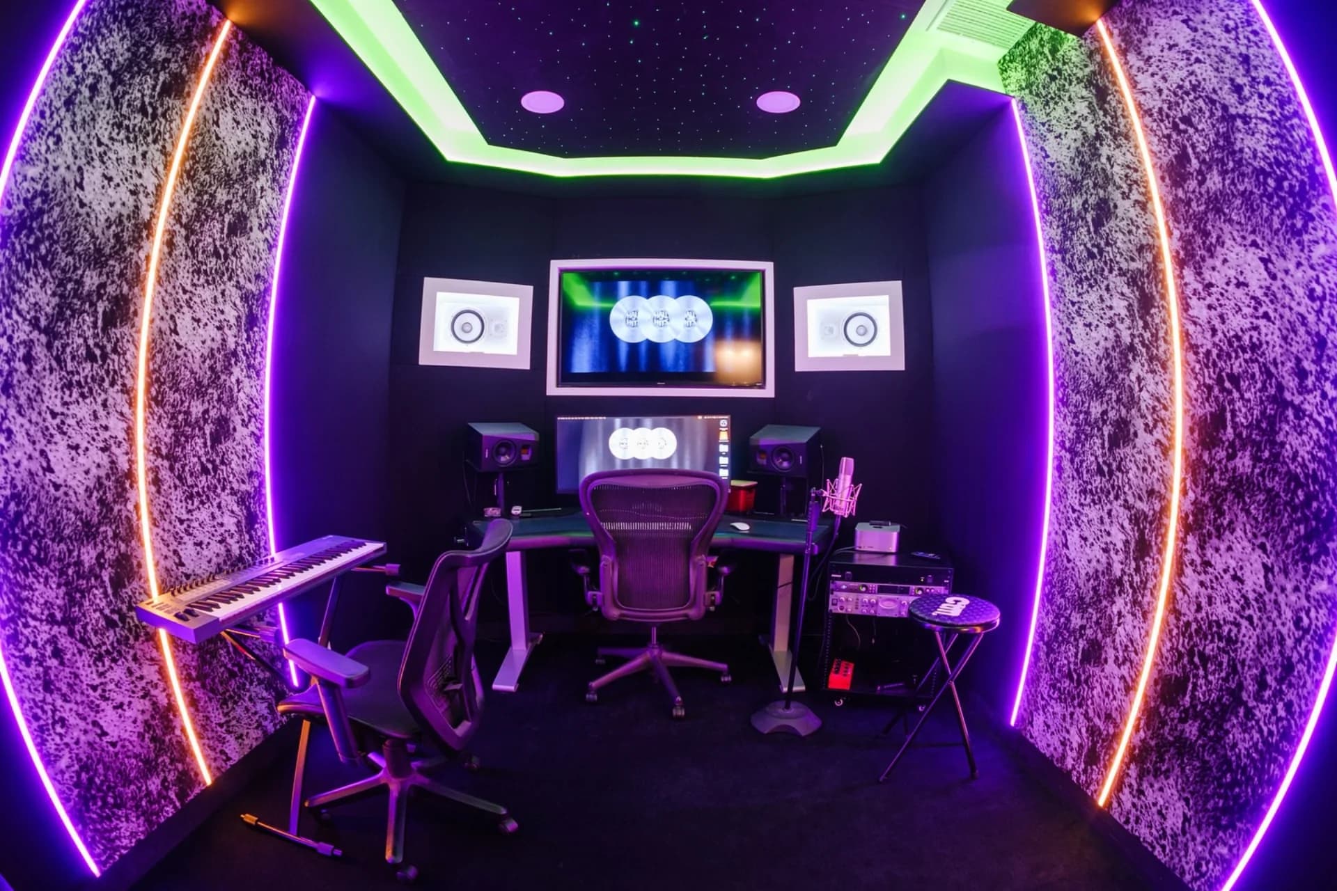 Hall of Hits Studio C with keyboard, microphone, monitors, and mixing position